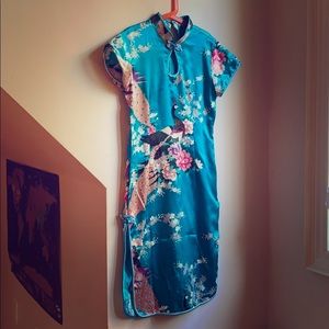 Size small qipao perfect for cultural events.